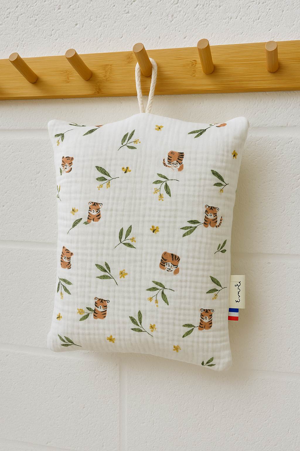 Le coussin de sieste avec cordon