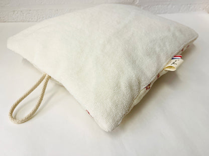 Le coussin de sieste avec cordon